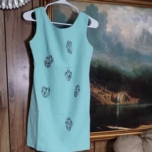 Mint Green Sleeveless Dress with Geometric Patterns